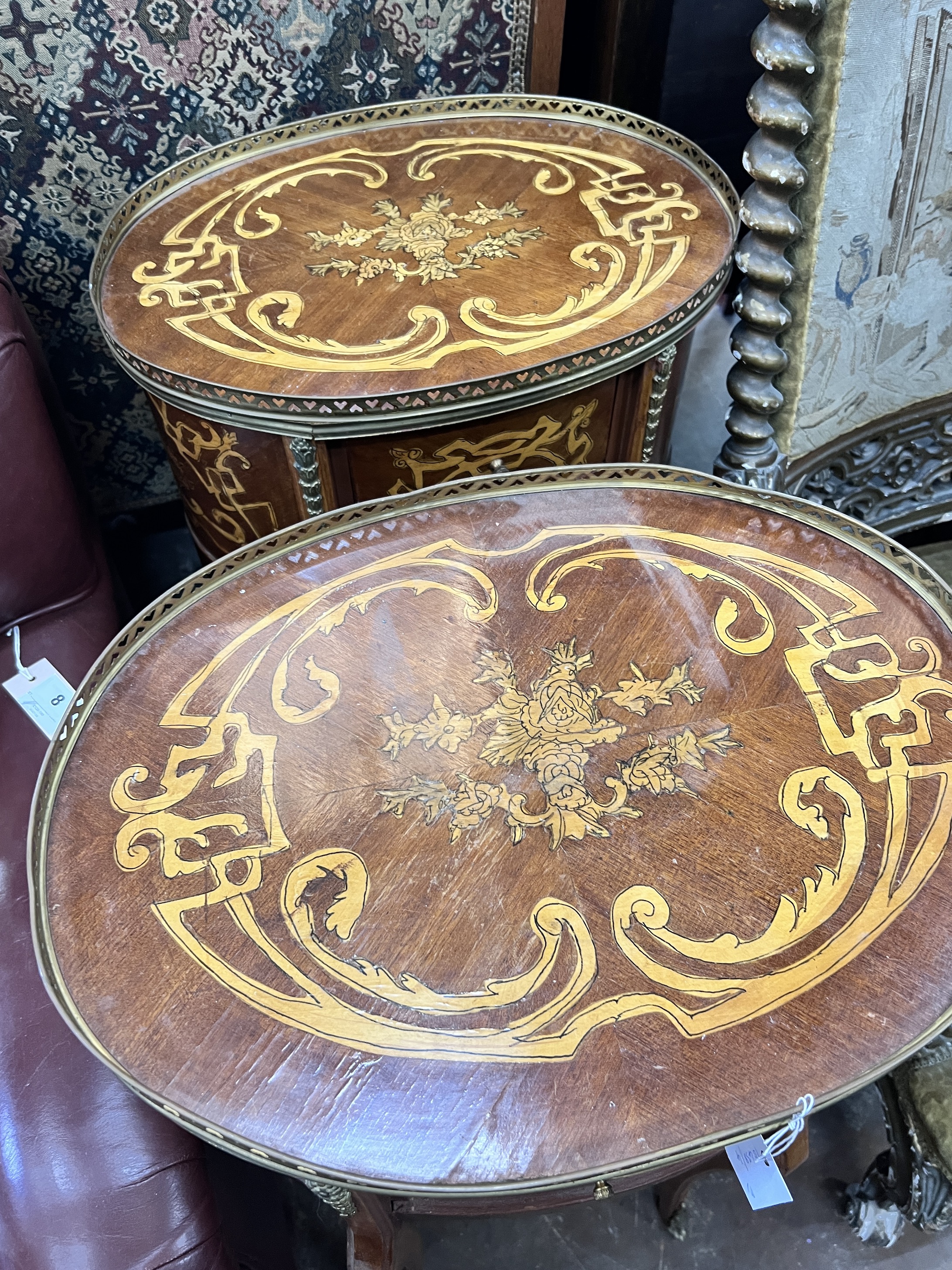 A pair of reproduction Louis XV style oval marquetry inlaid bedside chests, width 47cm, depth 36cm, height 77cm